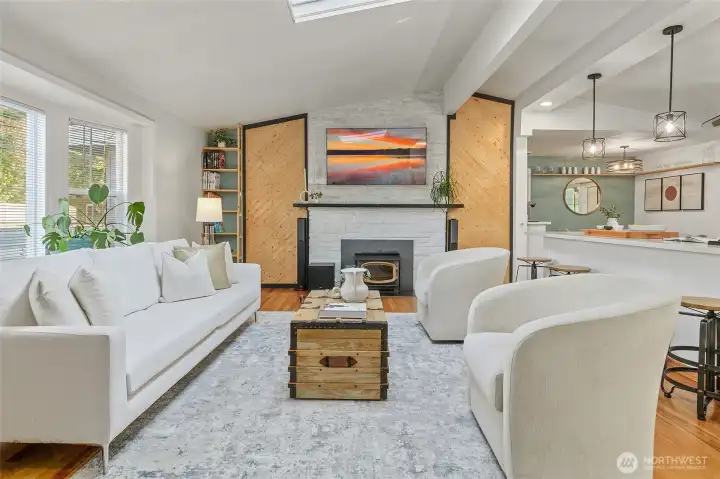 Wood burning fireplace insert flanked handsome wood accents.