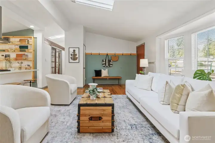 Living room view looking to main entry with convenient entry closet.