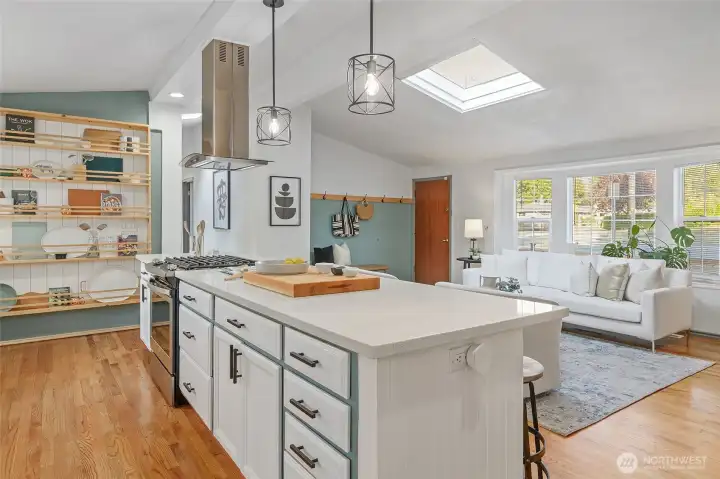 Center island with gas cooking and built in shelving for extra storage or display.
