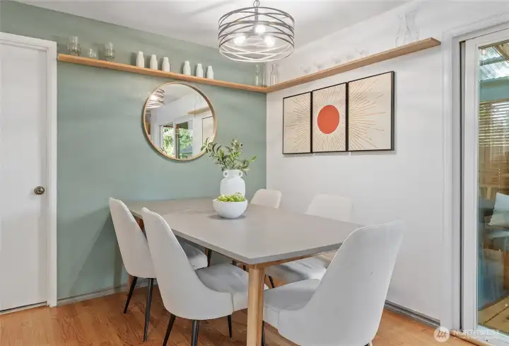 Dining space conveniently located off kitchen with easy access to cover deck with large entertainment space.