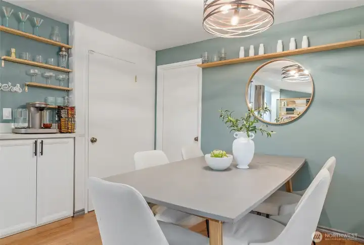 Dining space with cabinet perfect for a coffee bar.