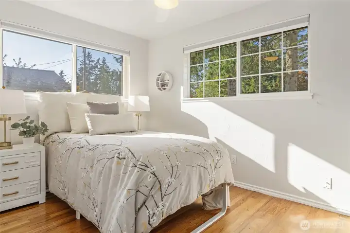Third bedroom with corner windows with yard outlooks.