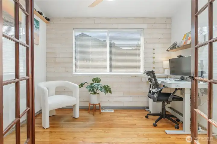 Light-filled bonus room with French doors. Could be used as den/office or extra bedroom.