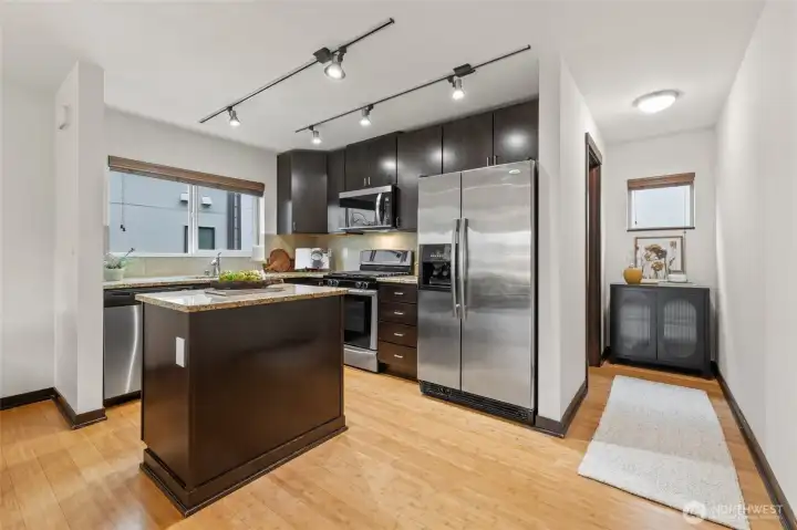 Entering the main level. half bath is just past kitchen to the right