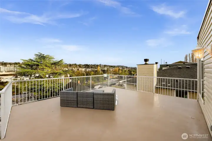 Spacious exterior deck, approximately 515 sq. ft., facing east.