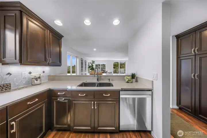 Open kitchen with breakfast bar.