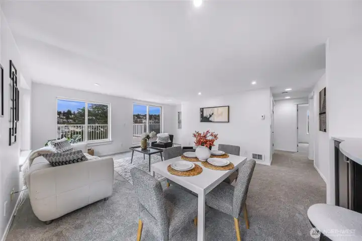 Open living and dining area with seamless deck access.