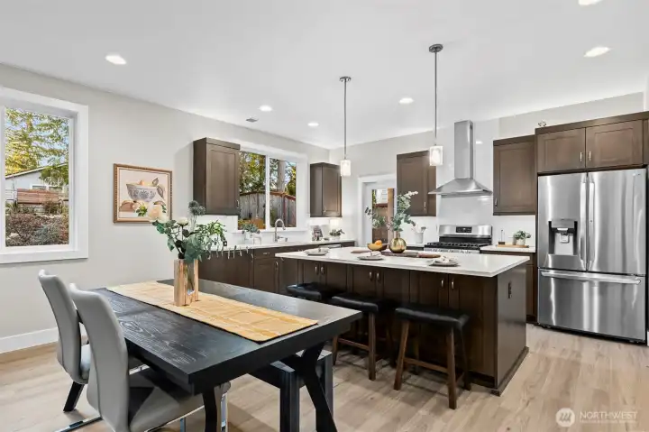 The kitchen was thoughtfully designed and upgraded with lighting both above and below the warm, richly stained cabinets.  In the evenings, the kitchen is extra cozy!