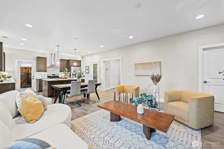 The great room looking back toward the pantry, foyer, and the oversized storage closet beyond the door on the right