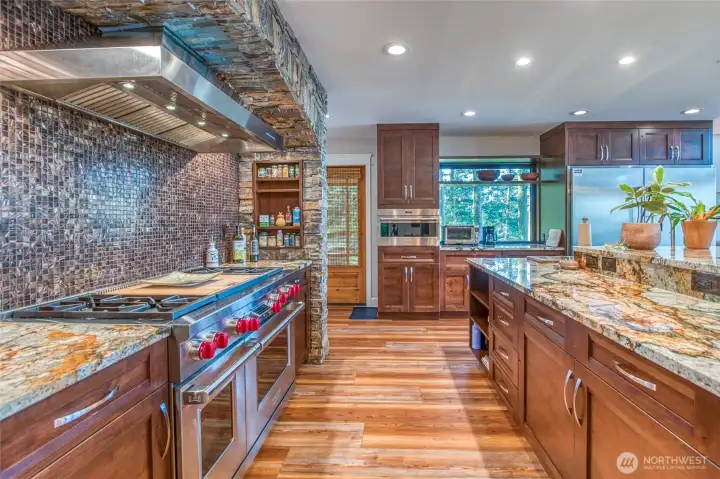 Remodeled kitchen will delight the most discerning chef and guests. Wolf and Electrolux appliances, granite countertops, plenty of lighting and space for all to jump in and get creative in the kitchen together.