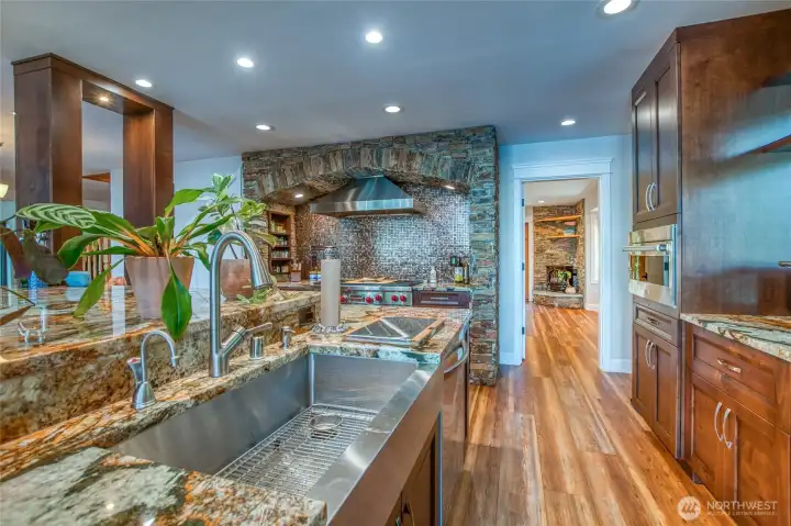 Undermount stainless steel single sink, dishwasher and plenty of counter makes for easy clean up.