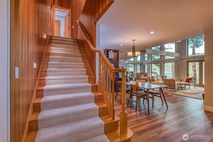 Stairs to the upper floor that opens up to a loft, 2 bedrooms and two baths.