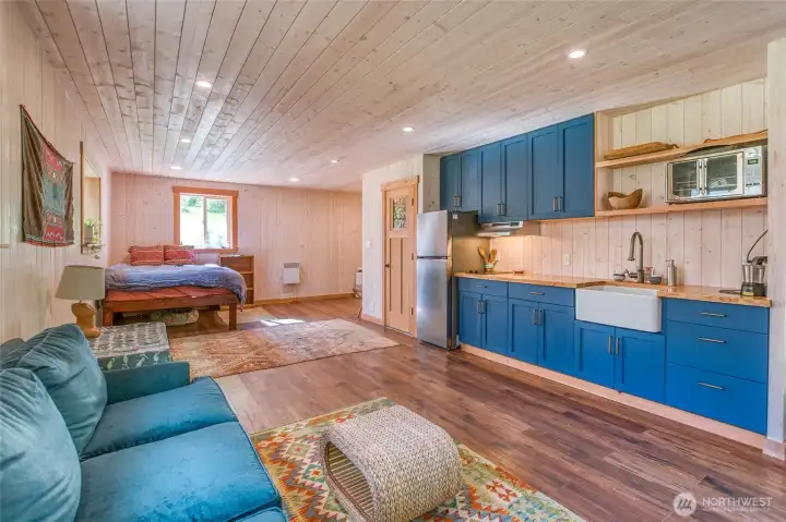 Lower studio includes kitchenette and bathroom.