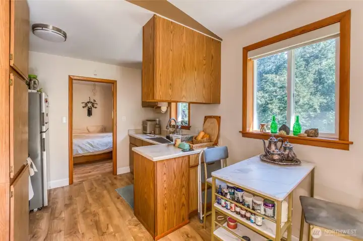 Upper apartment is a 1 bed- 1 bath with kitchen that opens up to a large room with wood stove.