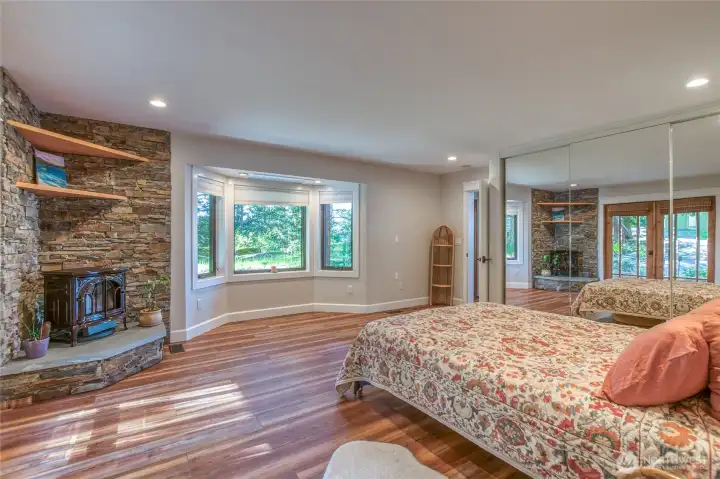 Main bedroom is large with plenty of light. Free standing stove keeps it cozy in the Northwest winter months.