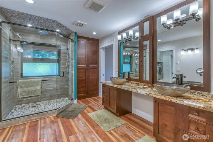 Ensuite bathroom is in harmony with main bedroom on main level. Filled with light and plenty of room.