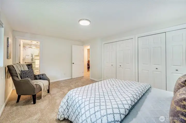 Spacious Primary Bedroom with ensuite bathroom and large closet.