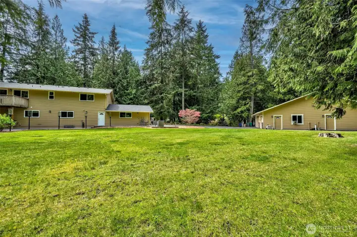 Back yard showing the Parking and location of both Garages/Shop