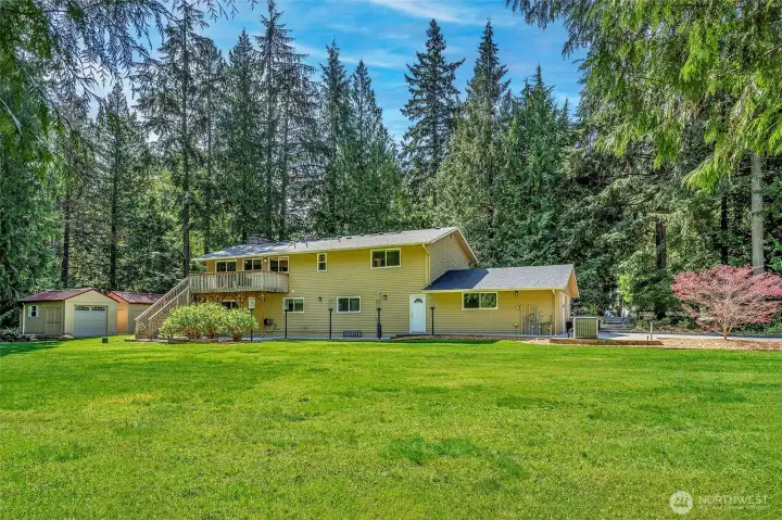 So much wonderful space, and there are Natural gas powered troches along the back walkway. Flat sunny lot with tree lined border. So peaceful