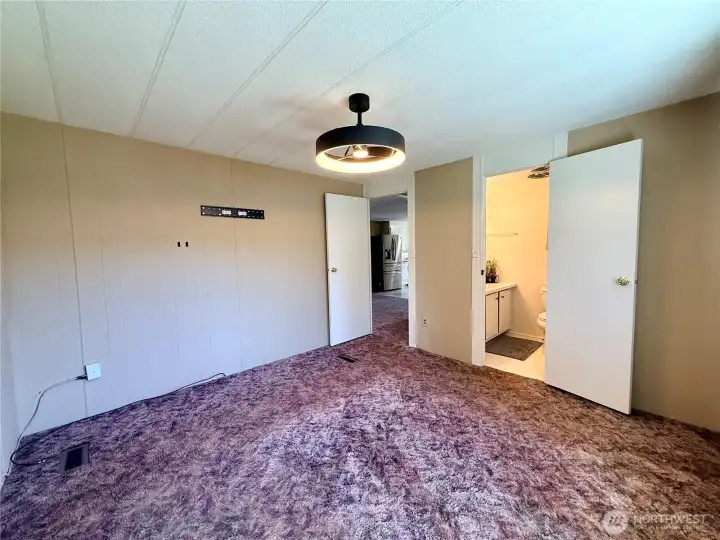 Another view of the primary bedroom.