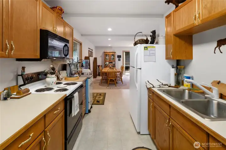 Comfortable Kitchen with double steel sink and built-in Microwave.