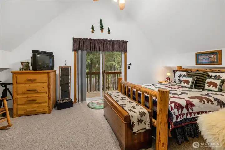 Upstairs primary bedroom with slider out to your upper western facing private deck.