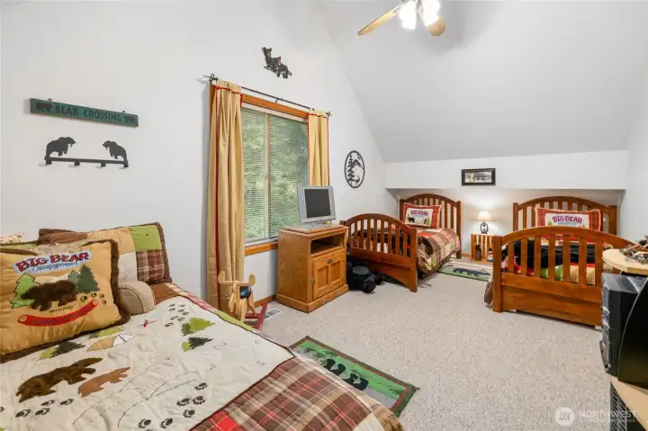Vaulted ceiling and fan.
