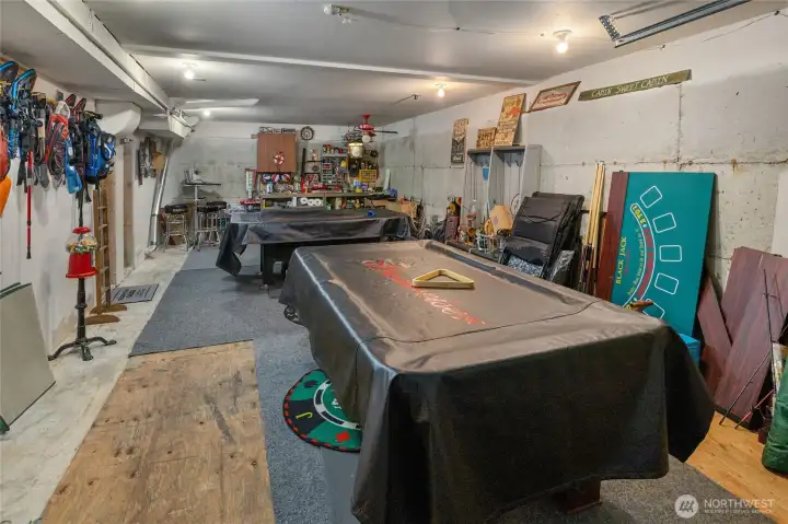 The 480 SF attached garage has been turned into the pool table room and provides extra storage.