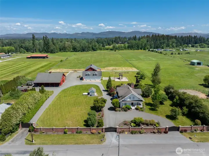 Three gated entrances into professionally landscaped English gardens. Pasture space straight back to the east and additional pasture to the back right.