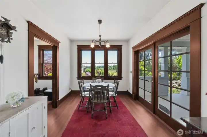 Kitchen eating space with french doors to patio on the right, mud room to outside to the left.