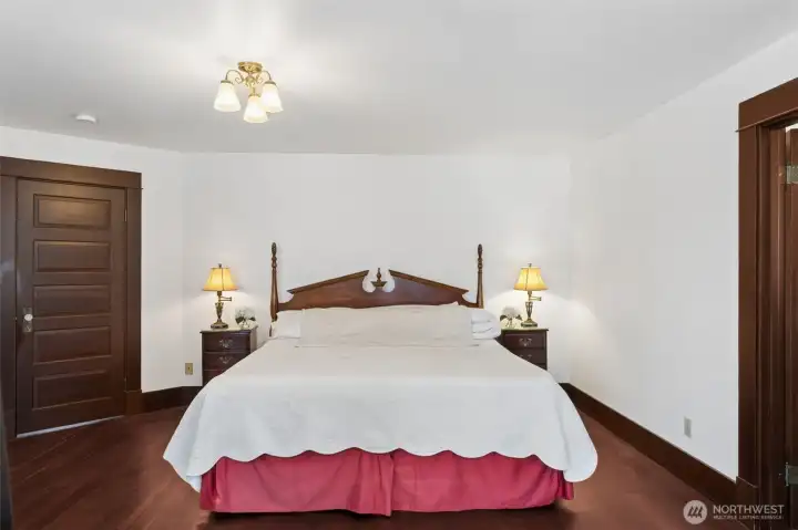 Door to master to the left, bathroom to the right. Master is very large with two seating spaces.