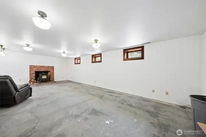 Basement with pellet stove. Wine cellar, utility room, 4 additional rooms with doors plus secret room. Exit to outside stairs next to bathroom.