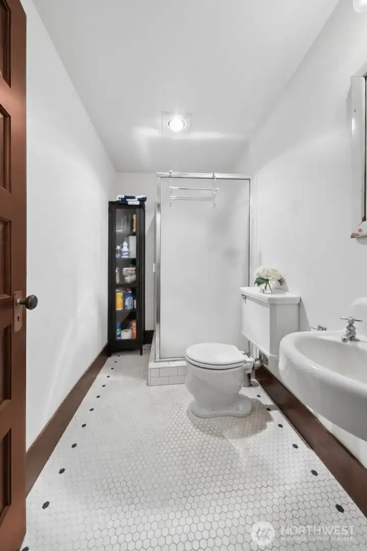Downstairs bathroom with shower.