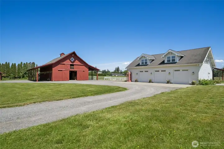 View exiting mud room.  Four stall brand new barn with huge loft space, chicken coop to the left and huge shop with 3,000 sq ft entertainment center space above shop. Kitchen space and full bathroom with shower above shop.