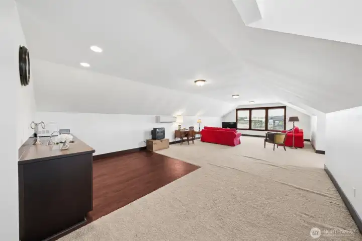 3,000 sq ft of living space above shop. Full bathroom with shower and little kitchen area. Great views of Mt. Rainier.