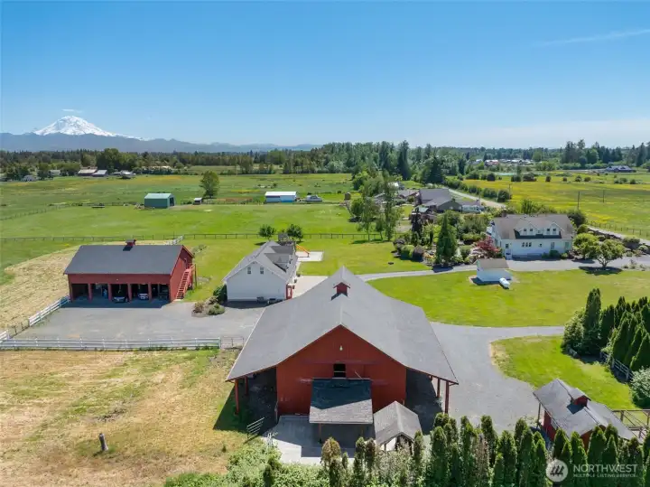 Ariel view of all buildings looking south. Pastures to the left. Cattle pen area on the front portion of this image. Chicken coop to the front right.
