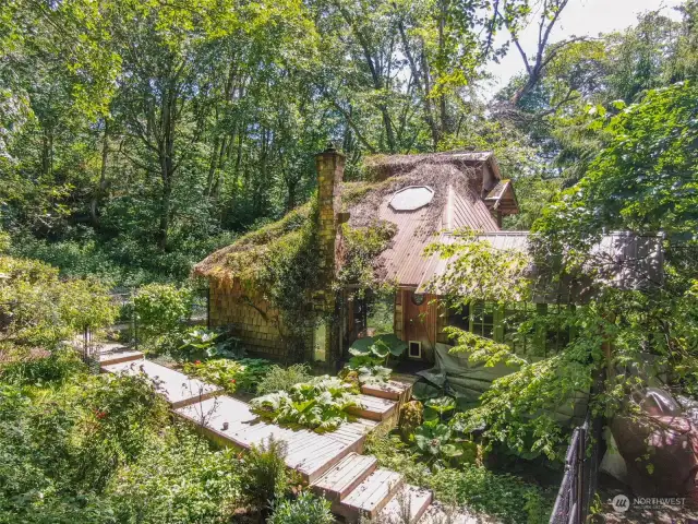 Main home surrounded by fencing to protect the garden area.