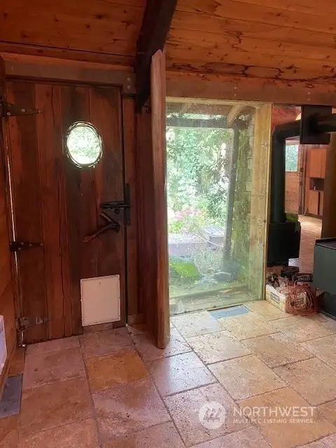 front door with huge ceiling to floor window to let in tons of natural light!