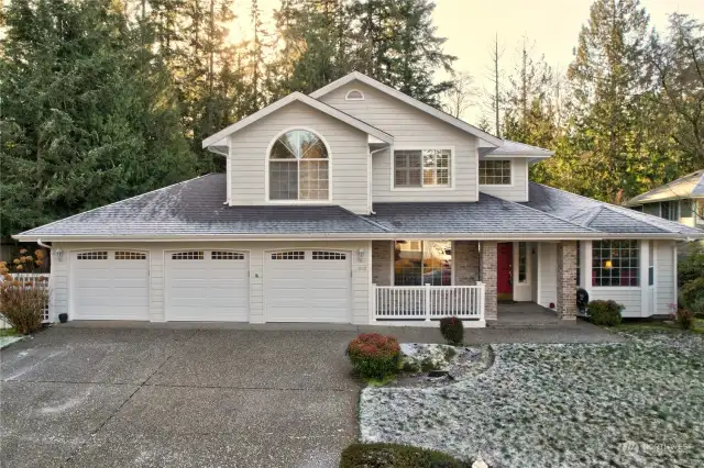 Traditional 2 story home with a 3 car garage and delightful covered porch