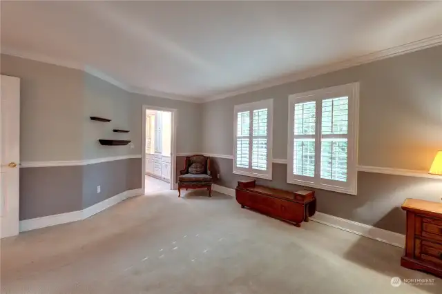 Another view of the primary suite, looking into the 3/4 bathroom