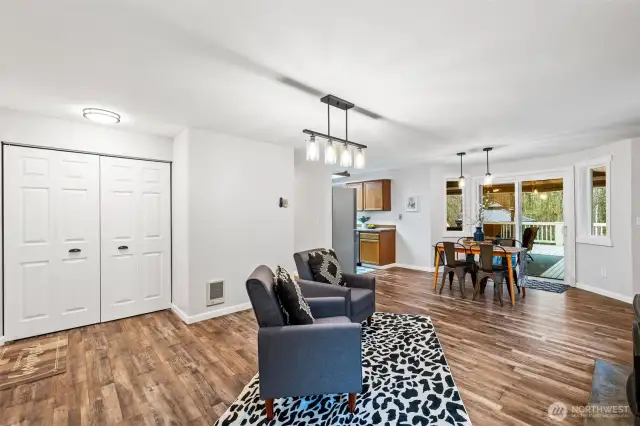 Down the hallway on the other side of the house is another gathering space which includes your laundry tucked away in the closet and the entrance to your garage.