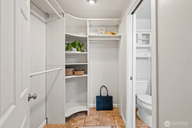 Through the closet from primary bedroom leads to the bathroom.