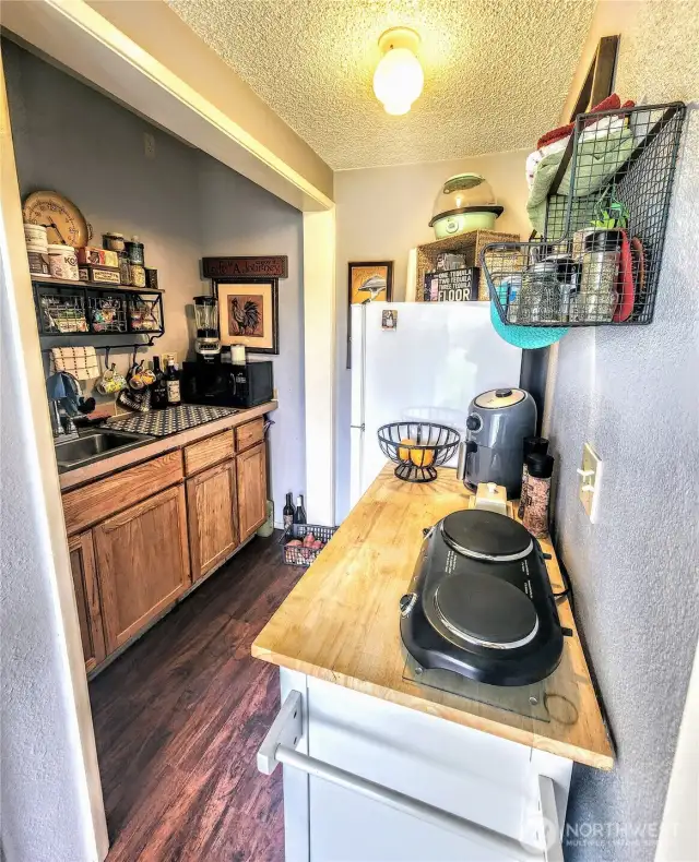 Entry and kitchen area in ADU space.