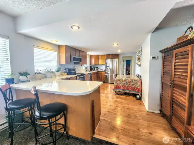 New quartz kitchen w/ eating bar and extensive cabinets.