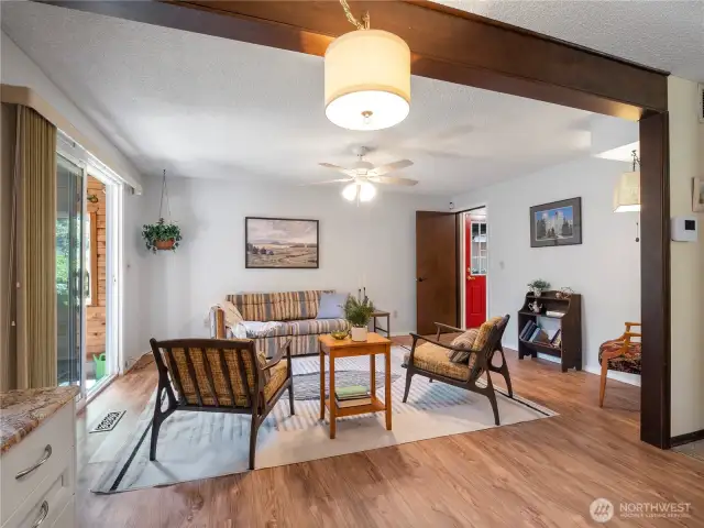 The additional living room right off the kitchen has access out to the sun room.