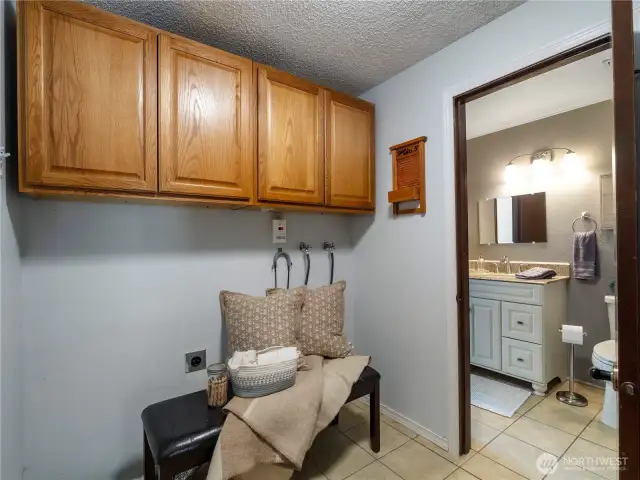The laundry room vets to the 3/4 bath on the bottom floor and to the garage entrance.