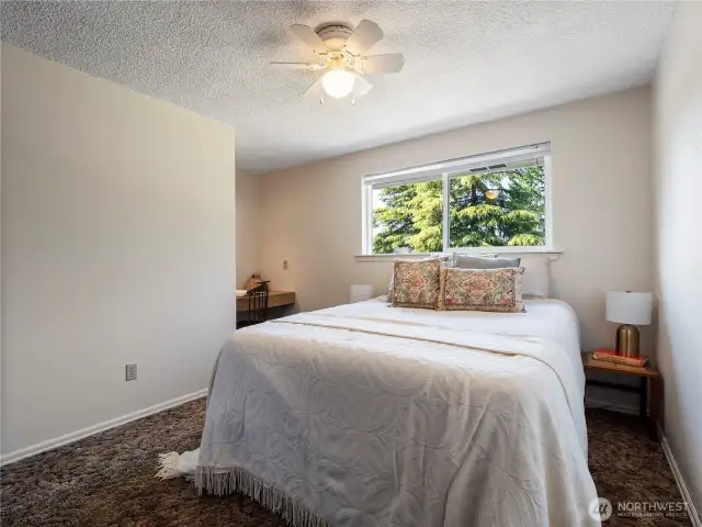 The smallest of the two bedrooms on the top floor has a built in desk.