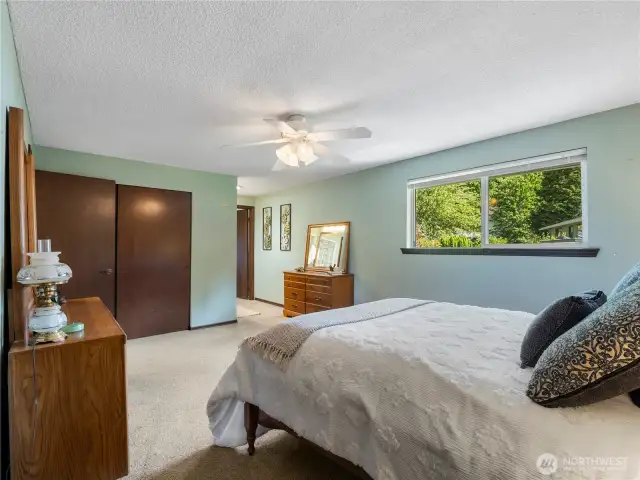 The primary bedroom has two large closets and an en suite.