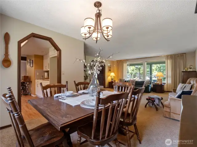 The kitchen is conveniently located for the chef to serve guests in the dining room.
