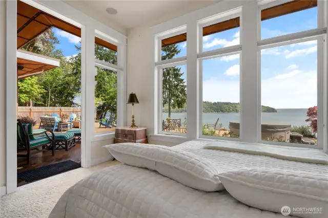 Primary suite has expansive windows for sweeping sunrise views of Puget Sound, Mount Rainier and direct access to deck